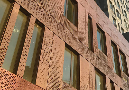 This dramatic copper and zinc facade of the 325 Kent apartment complex in the Williamsburg neighborhood in Brooklyn creates a distinguished street presence, with the copper and zinc emulating texture and depth.